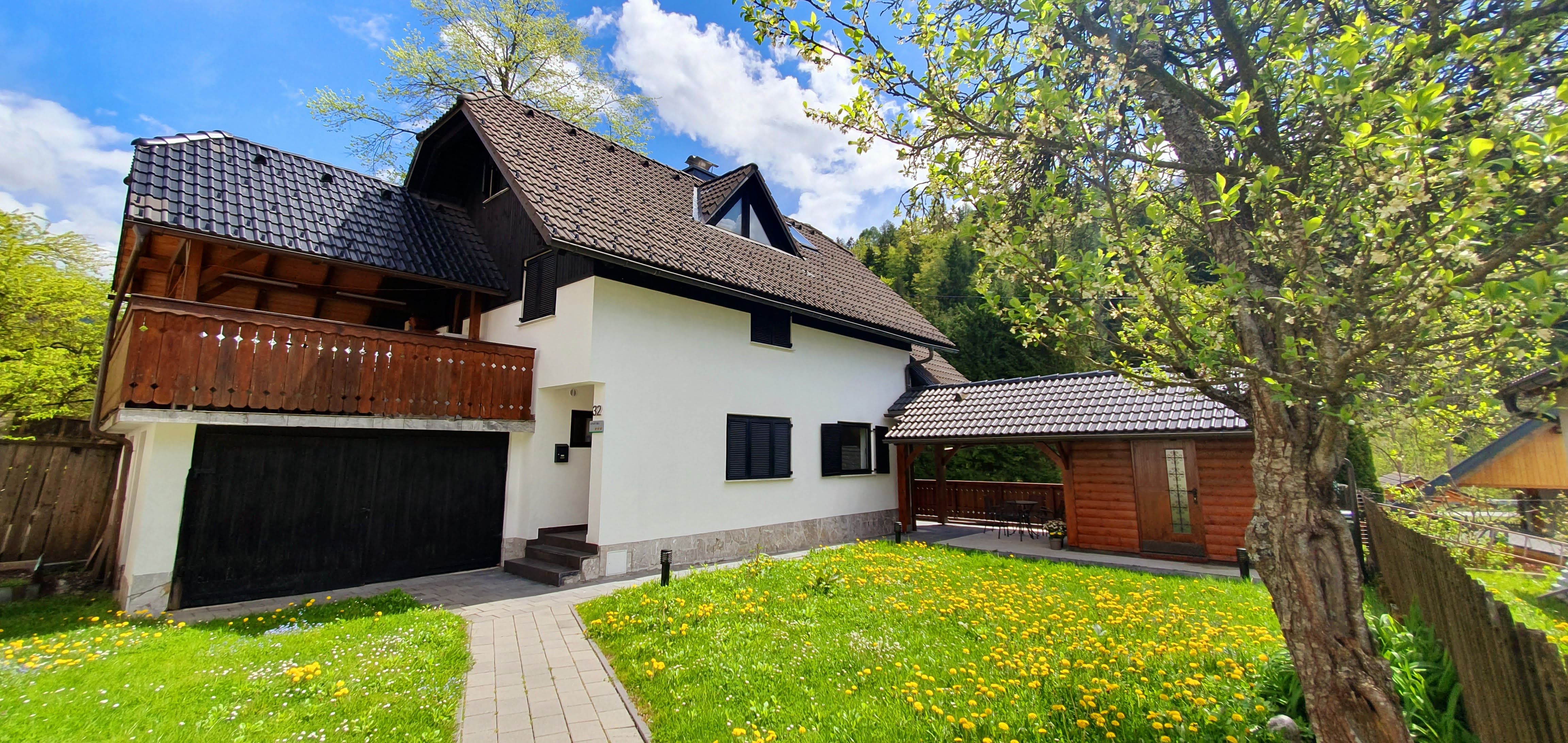 Alpska Astra house exterior with garden